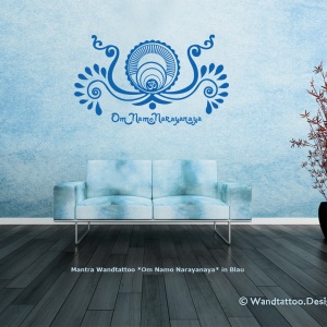 Modern blue couch in front of colorful wall